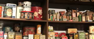 Different types of paper and plastic food packaing on a shelf.